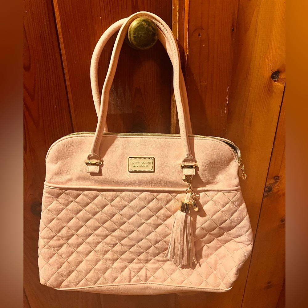 Light pink large Betsey Johnson bag with floral lining.